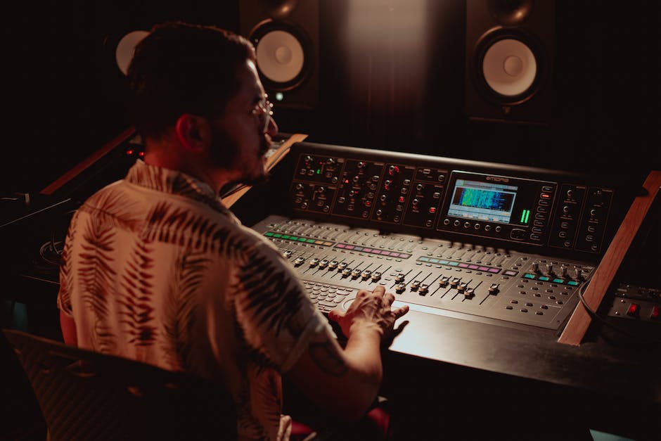 An image of a sound engineer working in a recording studio.